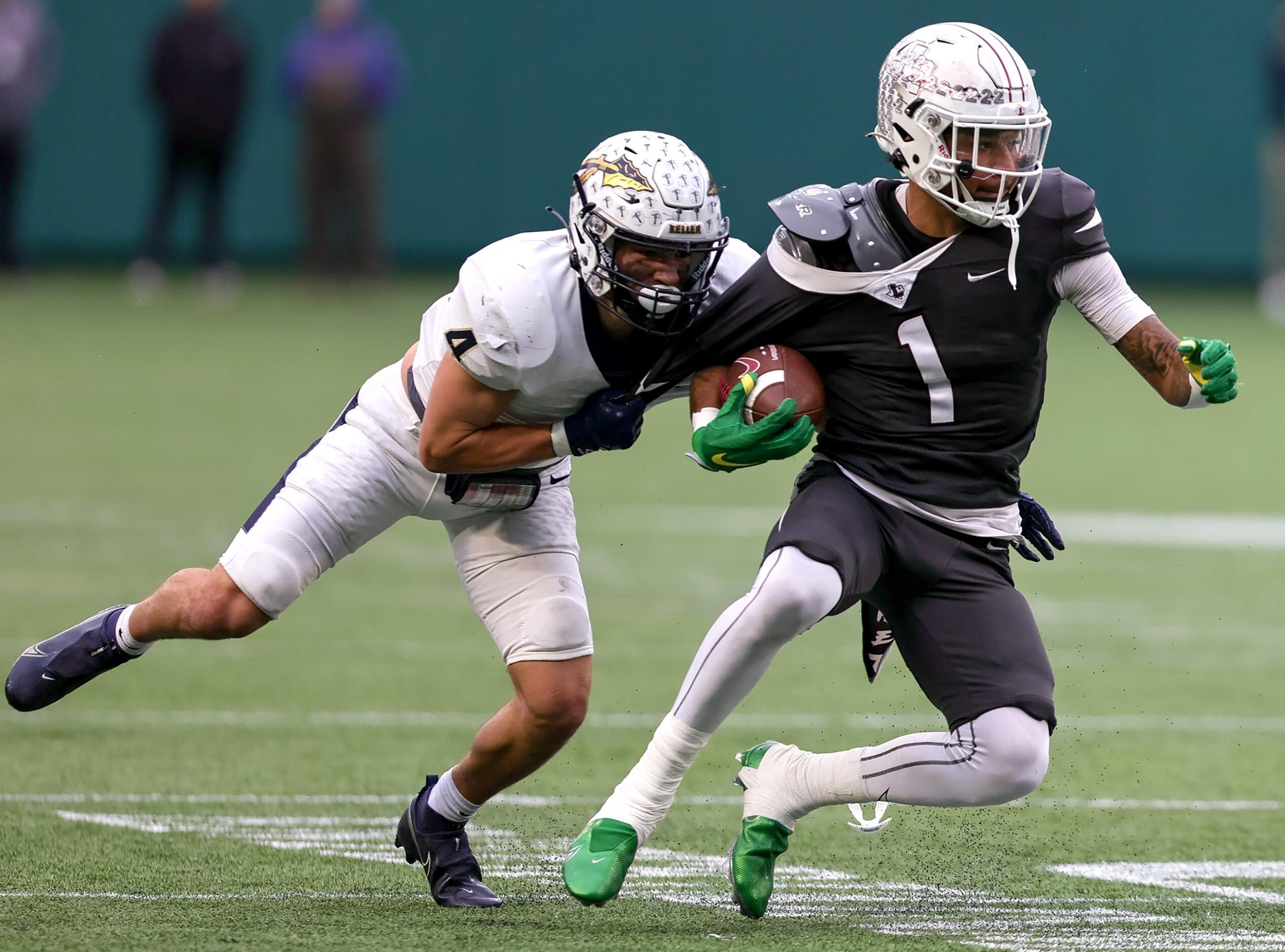 Lewisville wide receiver Jaydan Hardy (1) tries to break free from Keller defensive back Eli...