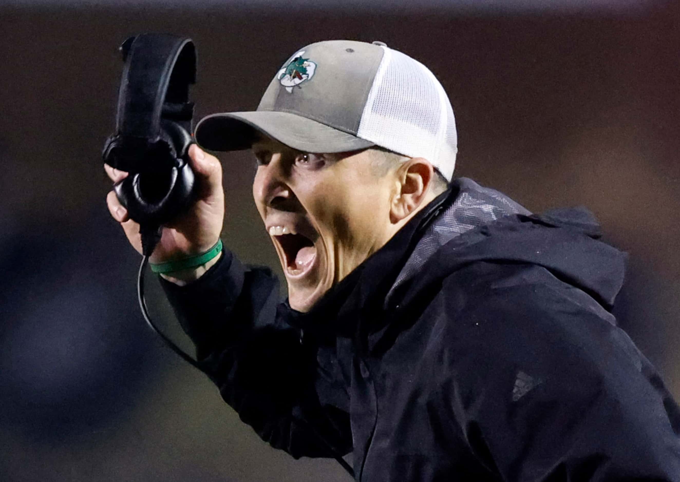 Southlake Carroll head coach Riley Dodge yells to remind his players of a possible fake punt...