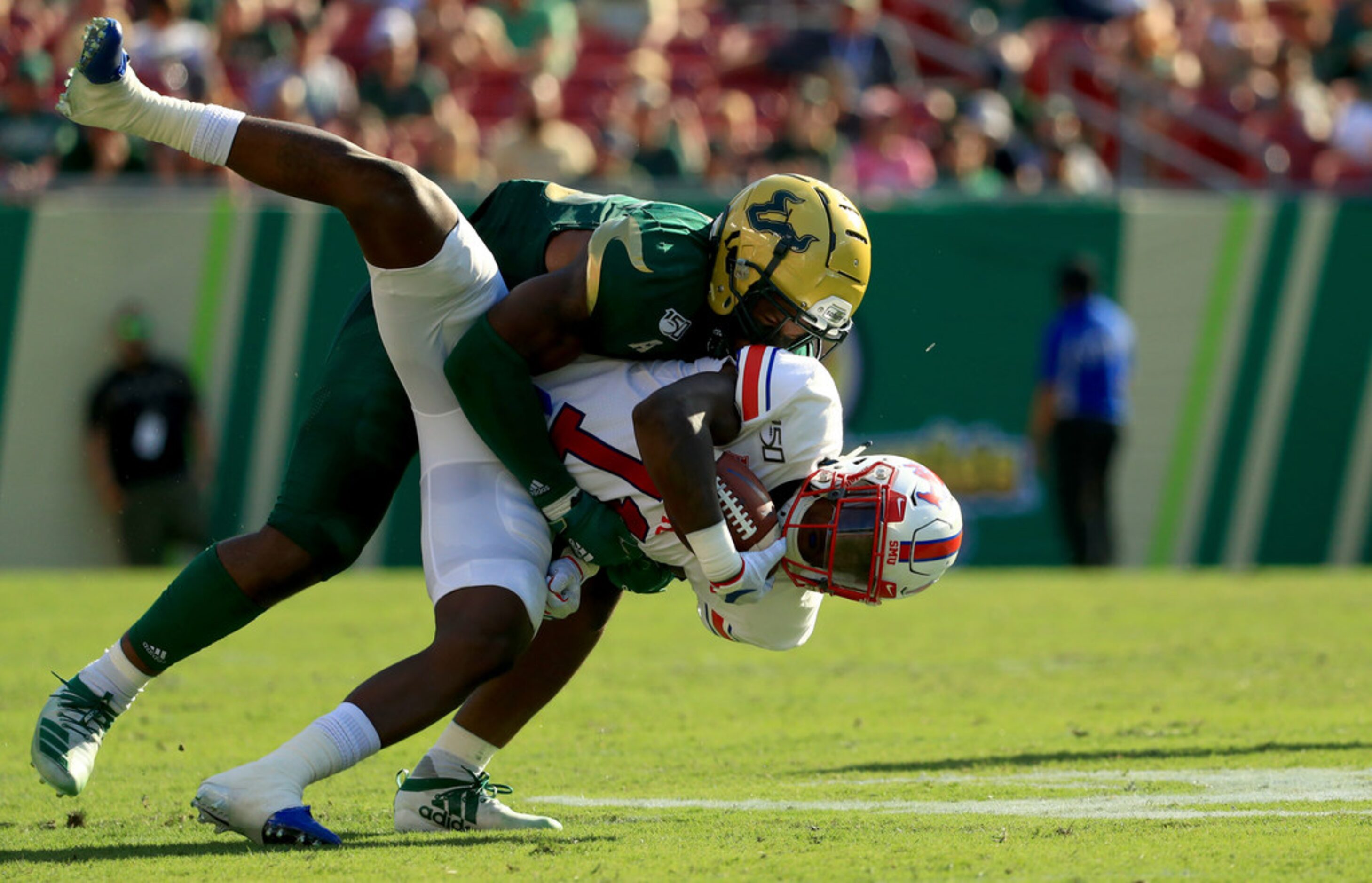 TAMPA, FLORIDA - SEPTEMBER 28: Rashee Rice #11 of the Southern Methodist Mustangs is tackled...