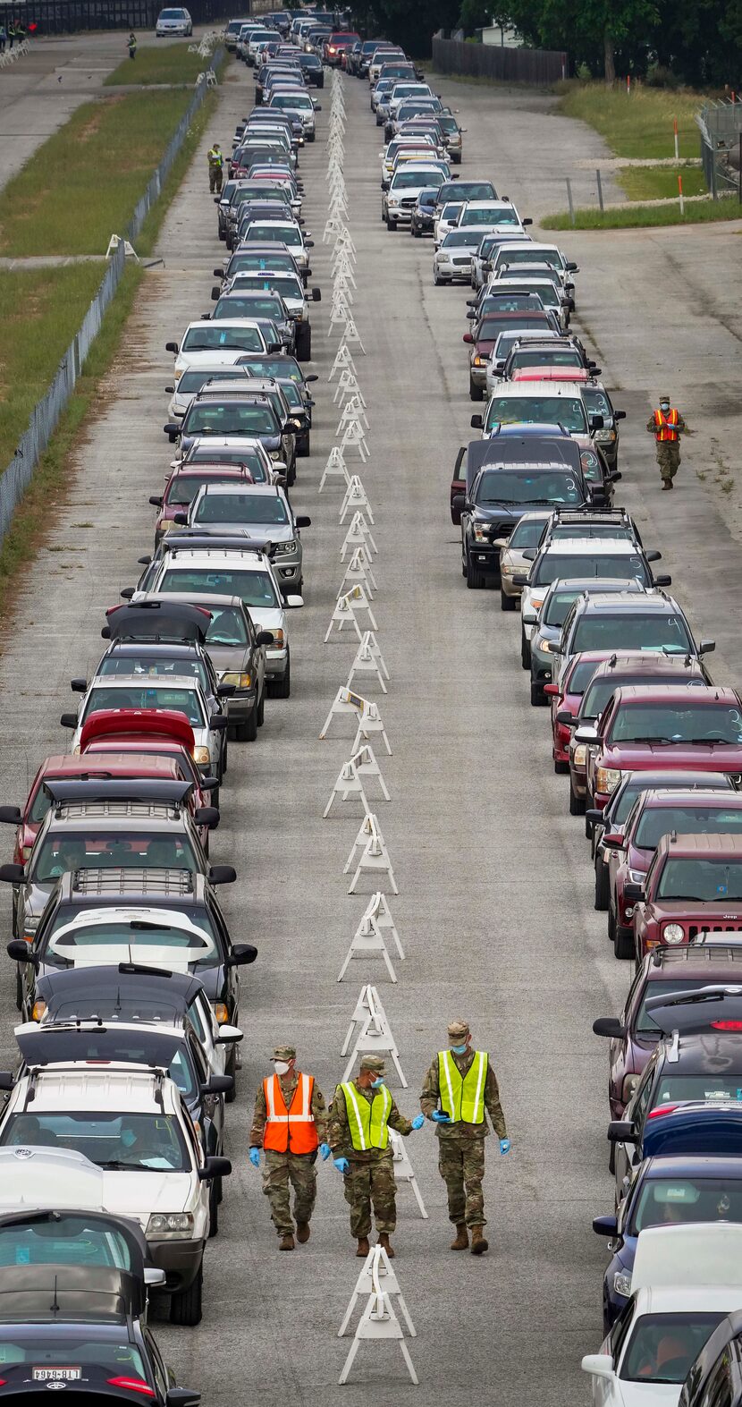 Cars lined up for the North Texas Food Bank's free food distribution at Fair Park.