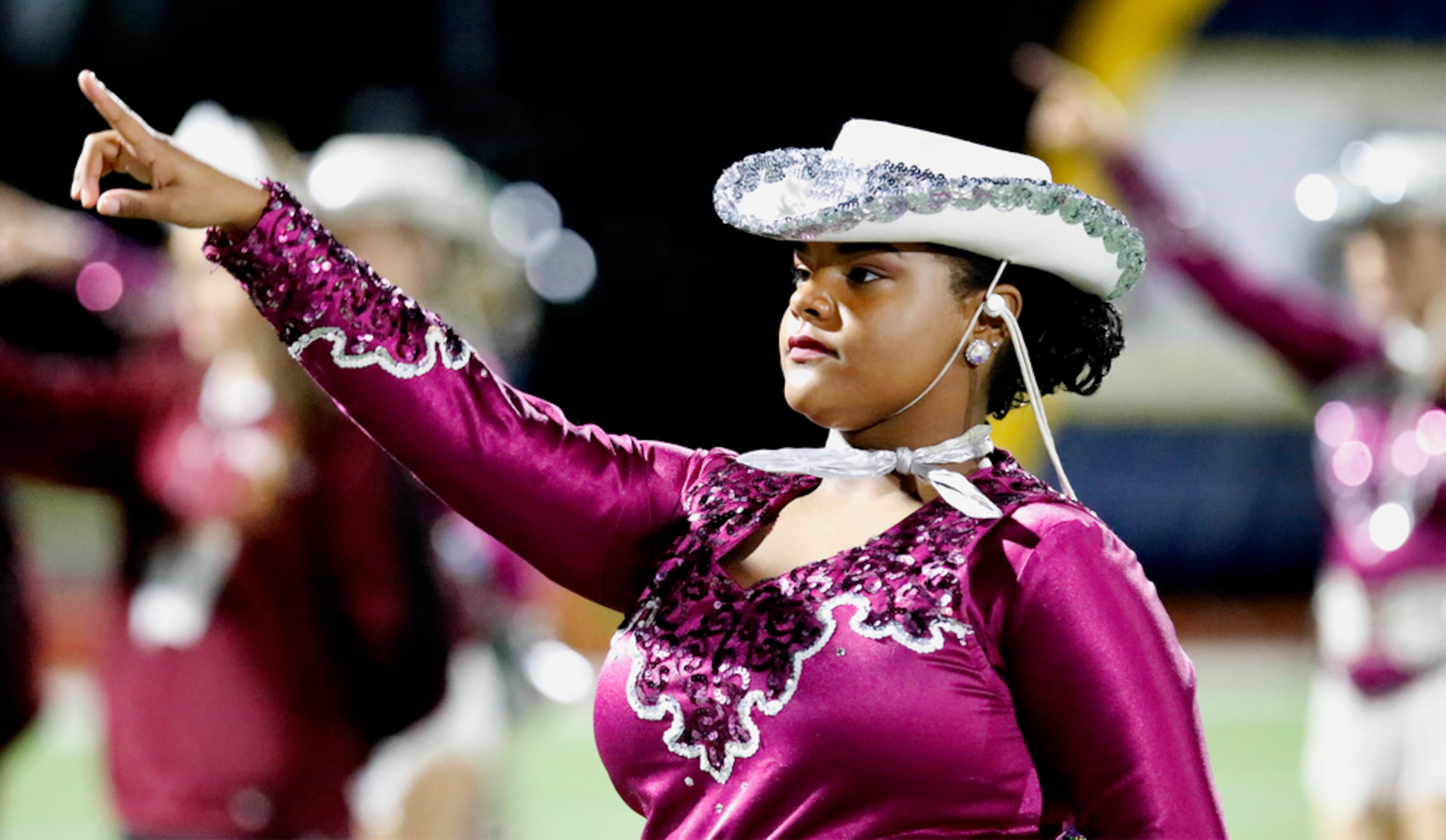 Erika Mims, 15, stands with the Pacesetters drill team during the Wylie High School song...