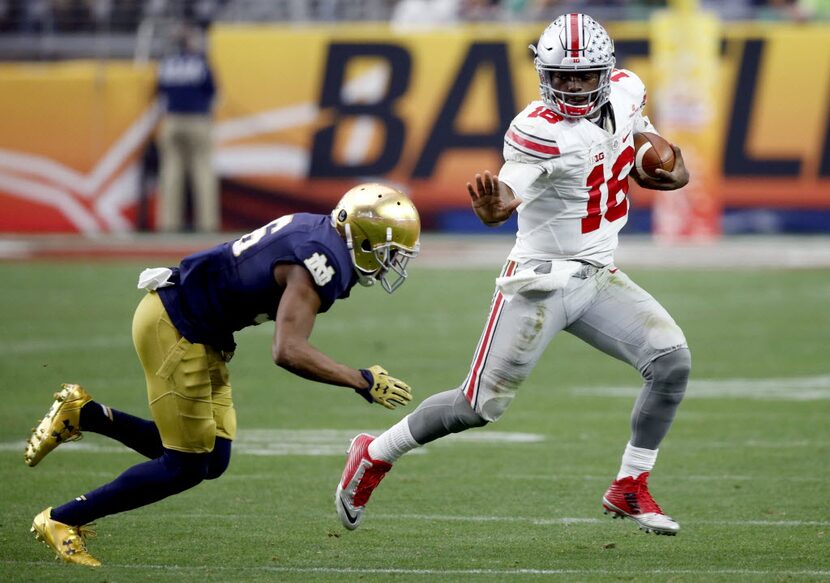 FILE - In this Jan. 1, 2016, file photo, Ohio State quarterback J.T. Barrett (16) tries to...