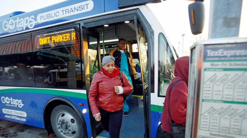 
Shiri Gupton of Prosper, exits the Texoma Paratransit System express bus as it arrived at...