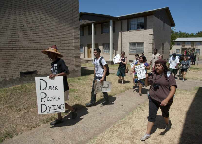 Protesters marched in the Dixon Circle neighborhood after the 2012 shooting of James Harper.