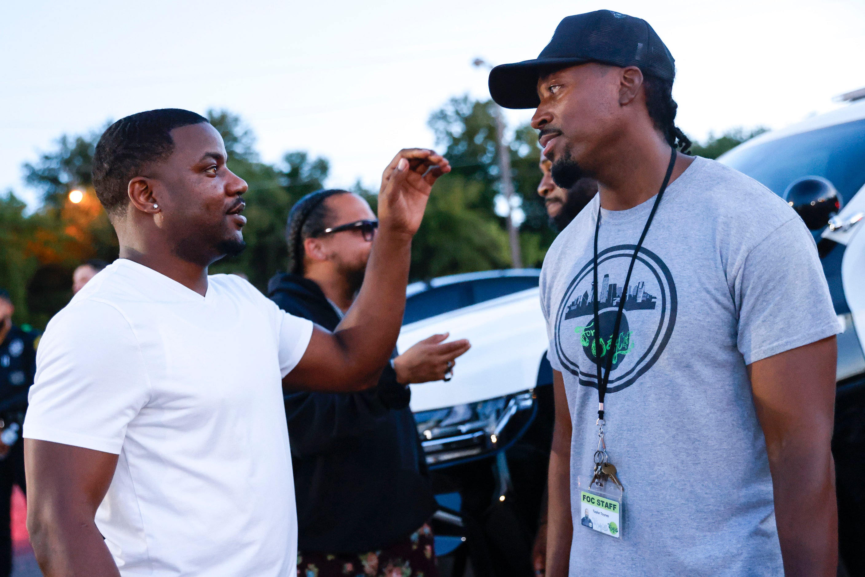 Taylor Toynes, For Oak Cliff co-founder, interacts following a vigil honoring Dallas police...