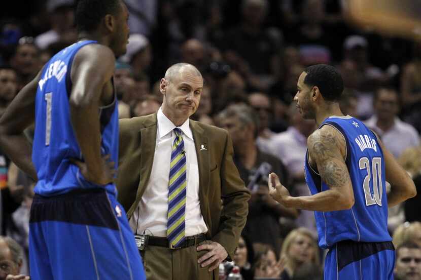 Dallas Mavericks head coach Rick Carlisle stands dejected as he listens to Dallas Mavericks...