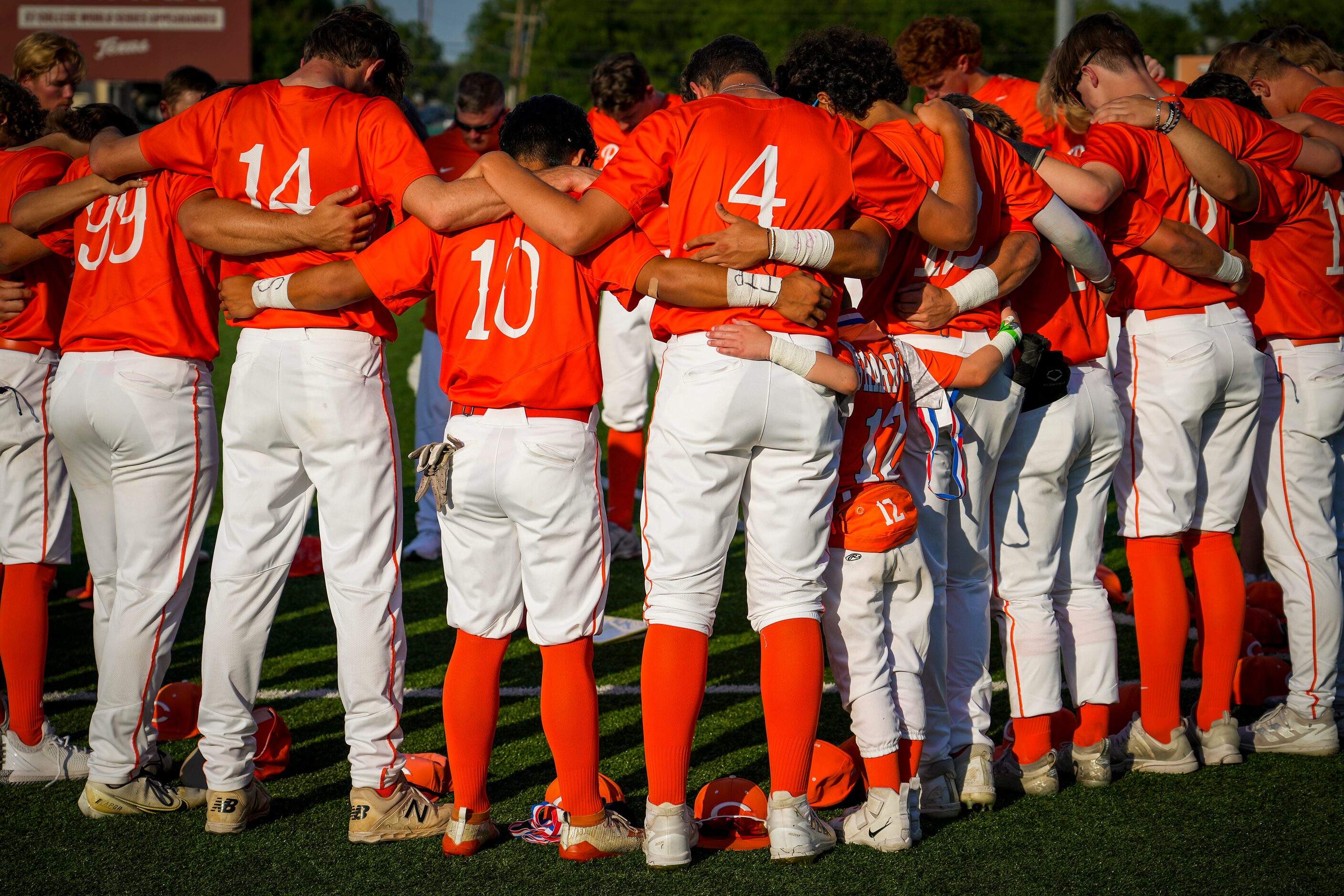 Celina players huddle in the outfield after a loss to Sinton in a UIL 4A baseball state...