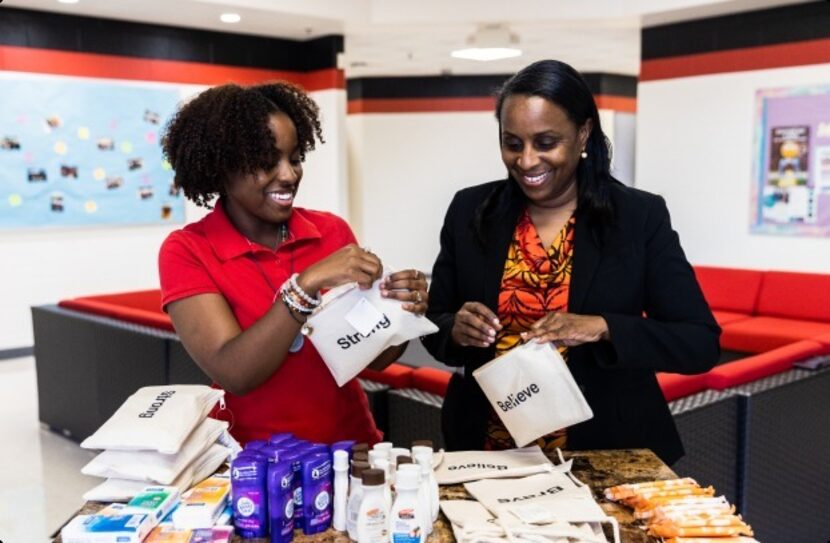 Taylor McCowan and her mother, Cornelia McCowan, assemble bags for The Confident Girl Project.