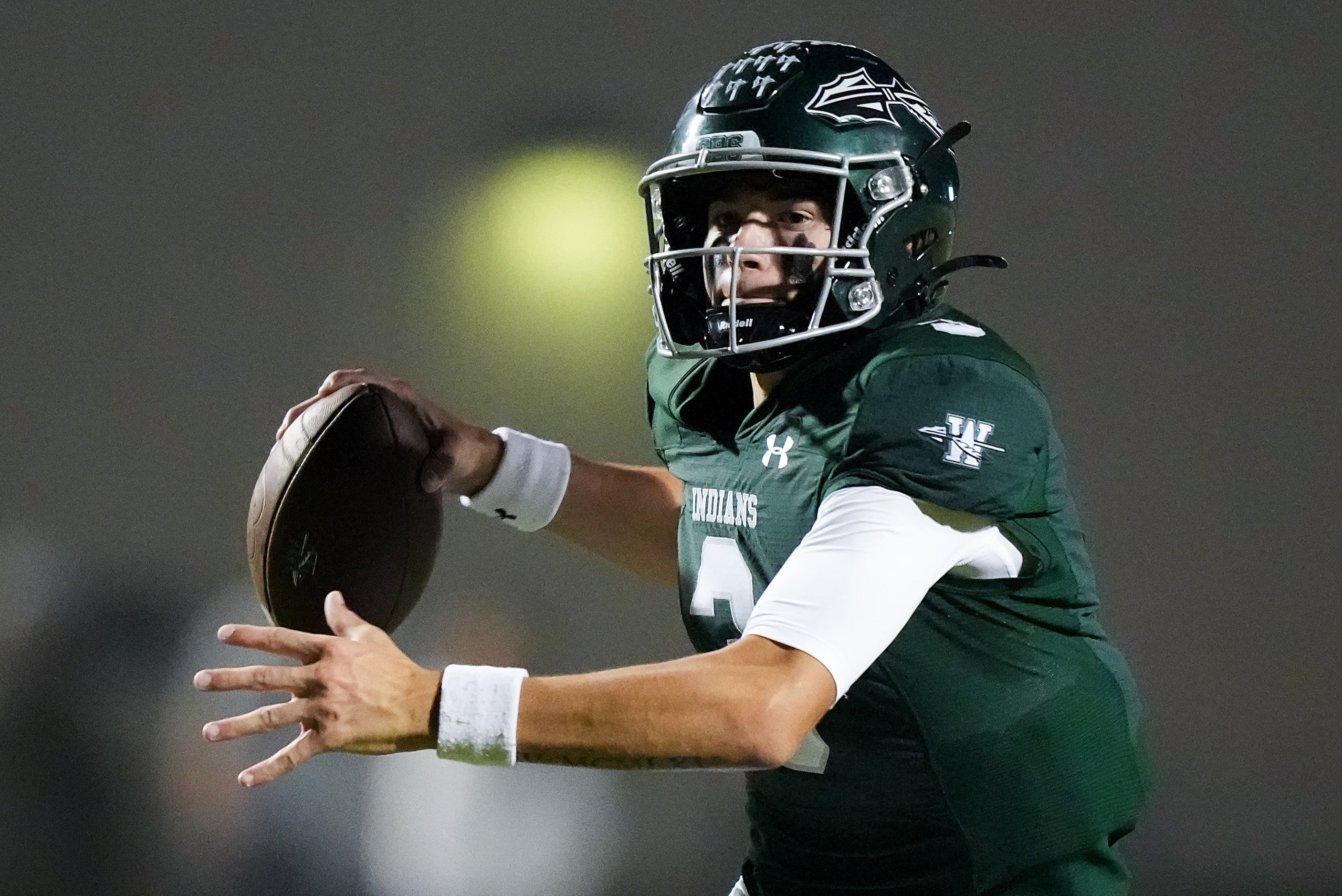 Waxahachie quarterback Jerry Meyer III (3) looks to pass during the first half of a District...