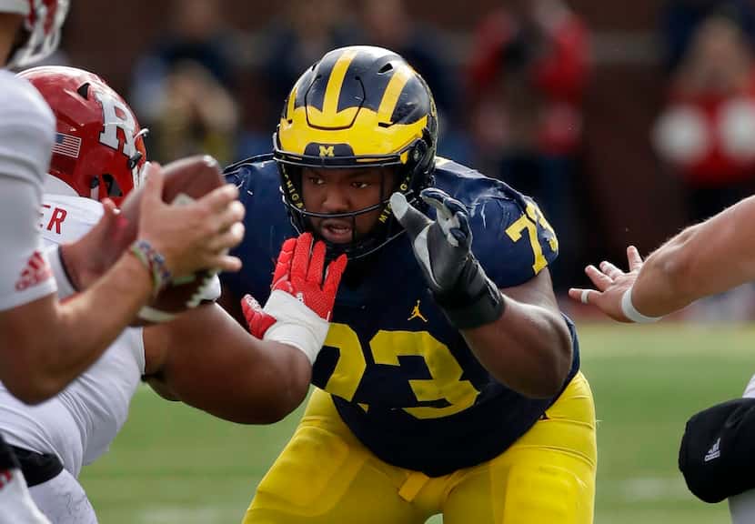 FILE - In this Oct. 28, 2017 file photo Michigan defensive lineman Maurice Hurst (73) goes...