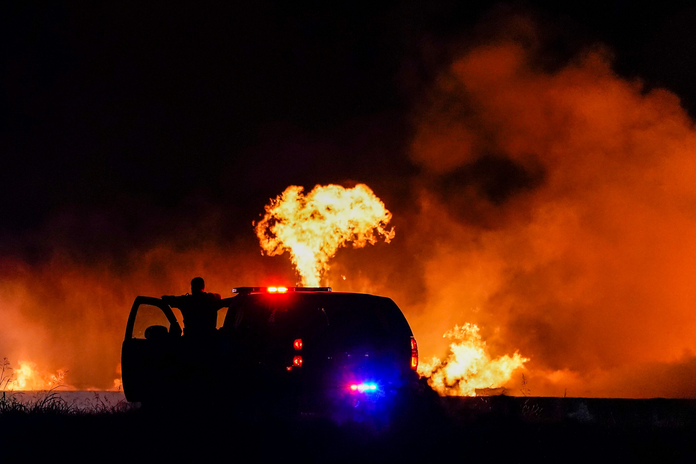 Fire crews battle a massive blaze in an industrial area of Grand Prairie in the early...