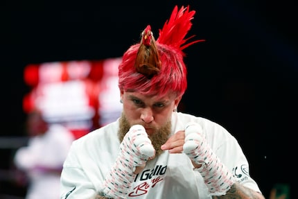 Jake Paul wears a rooster hairpiece during an open workout ahead of his boxing match against...