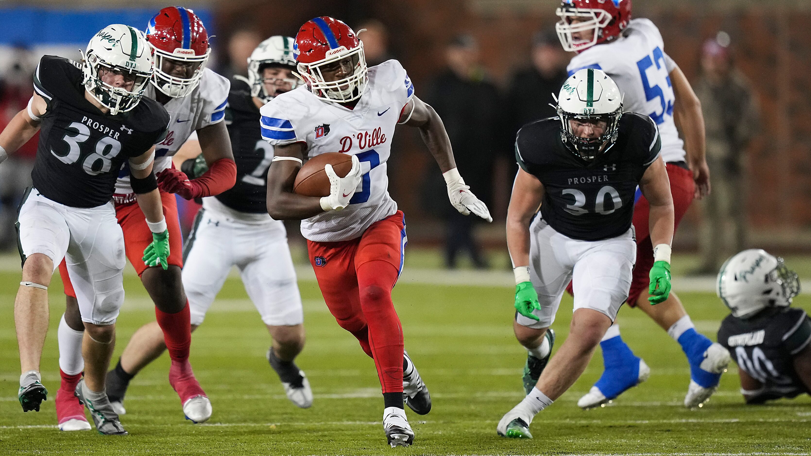 Duncanville running back Kaleb Kenney (9) races through the Prosper defense during the...