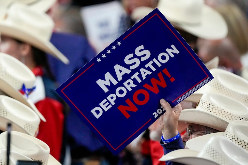 FILE - A member of the Texas delegation holds a sign during the Republican National...