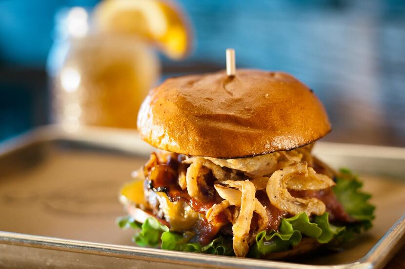 The Haystack Burger (pictured) comes with onions, cheddar cheese, apple wood smoked bacon,...