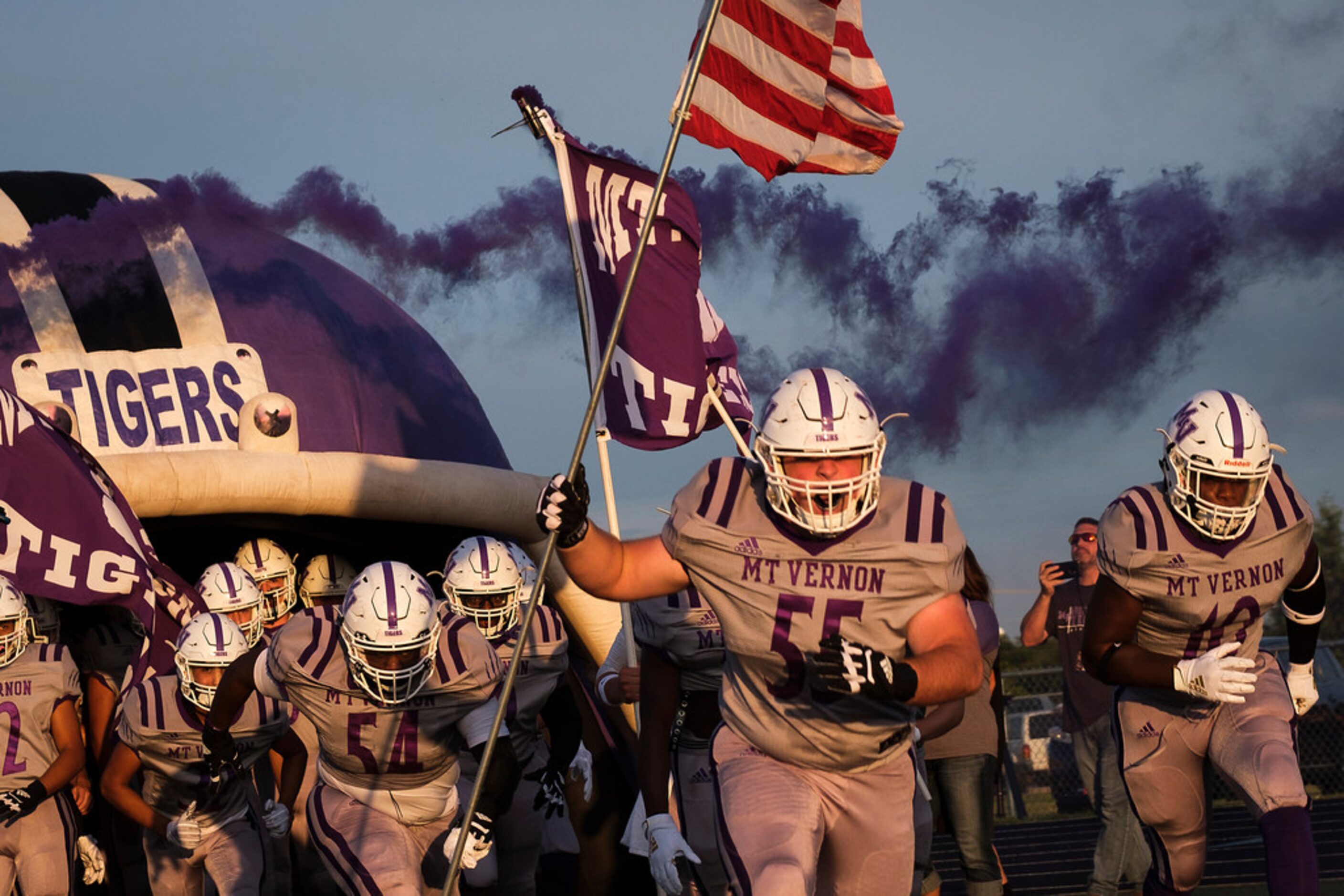 Mount Vernon high school players take the field for their first game under coach Art Briles...