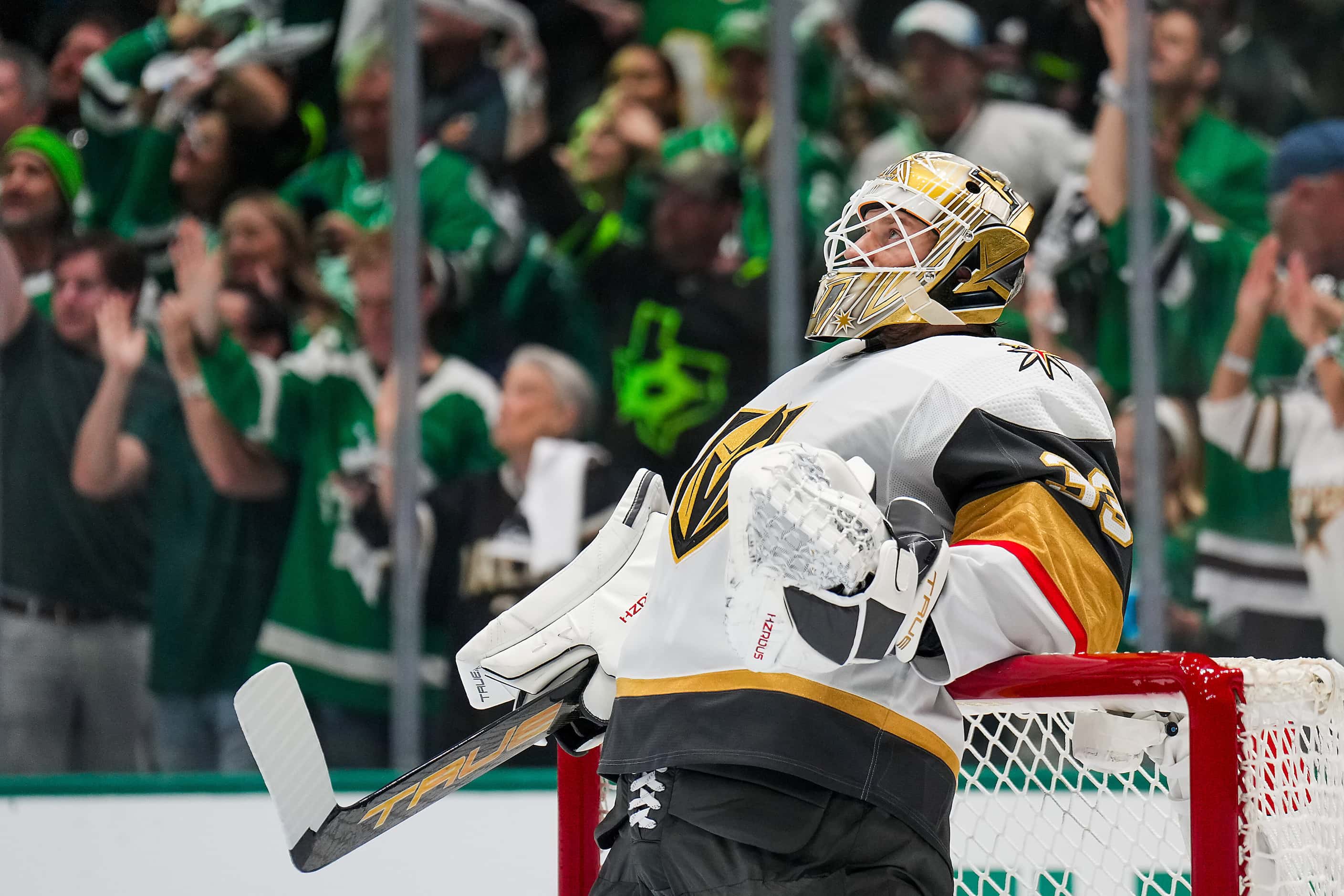 Vegas Golden Knights goaltender Adin Hill looks up at the scoreboard after a goal by Dallas...