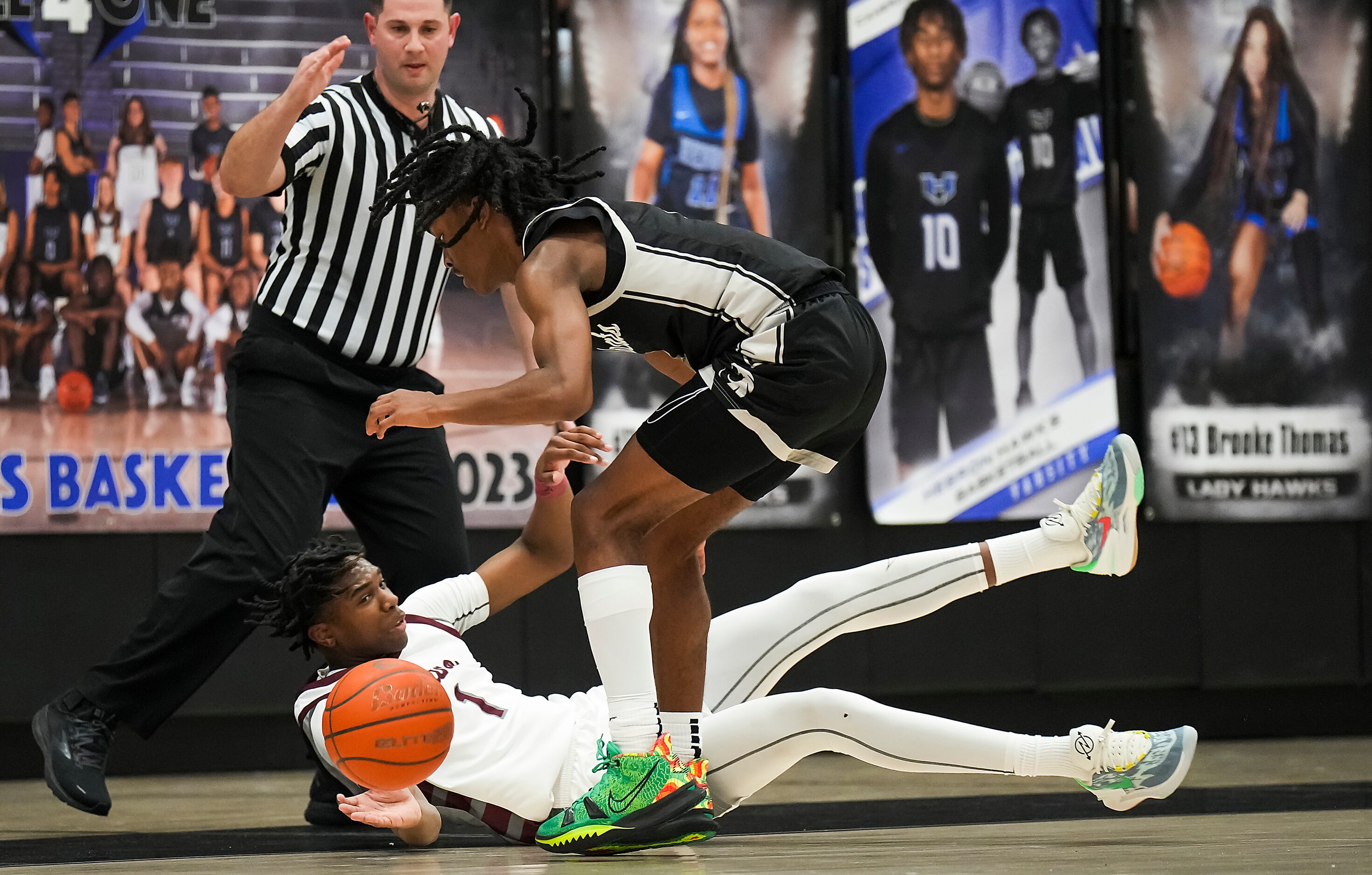 Plano guard Tyran Mason (1) scrambles for a loose ball against Denton Guyer guard Jeremiah...