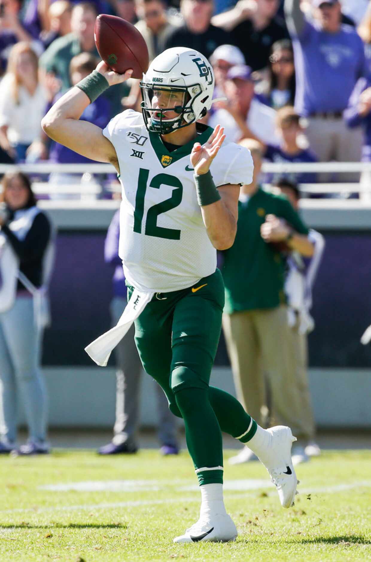 Baylor Bears quarterback Charlie Brewer (12) fires off a pass during the first half of an...