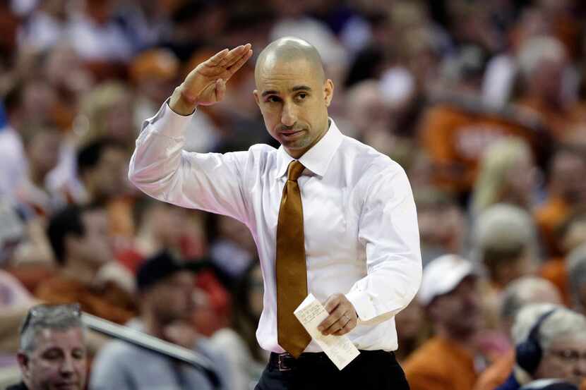 Texas head coach Shaka Smart signals to his players during the second half of an NCAA...
