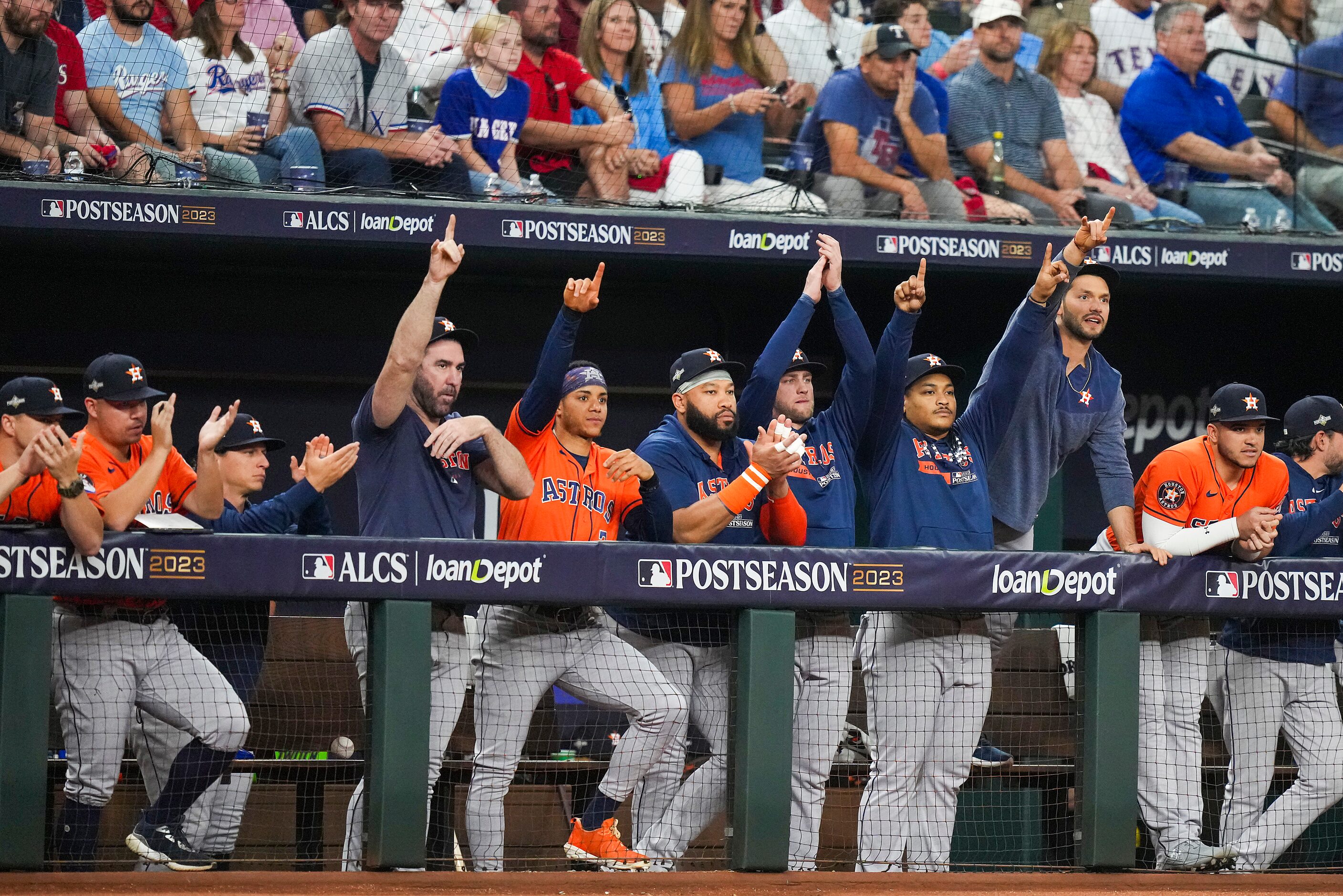 Houston Astros payers celebrate in the dugout after a double by Jose Altuve during the first...