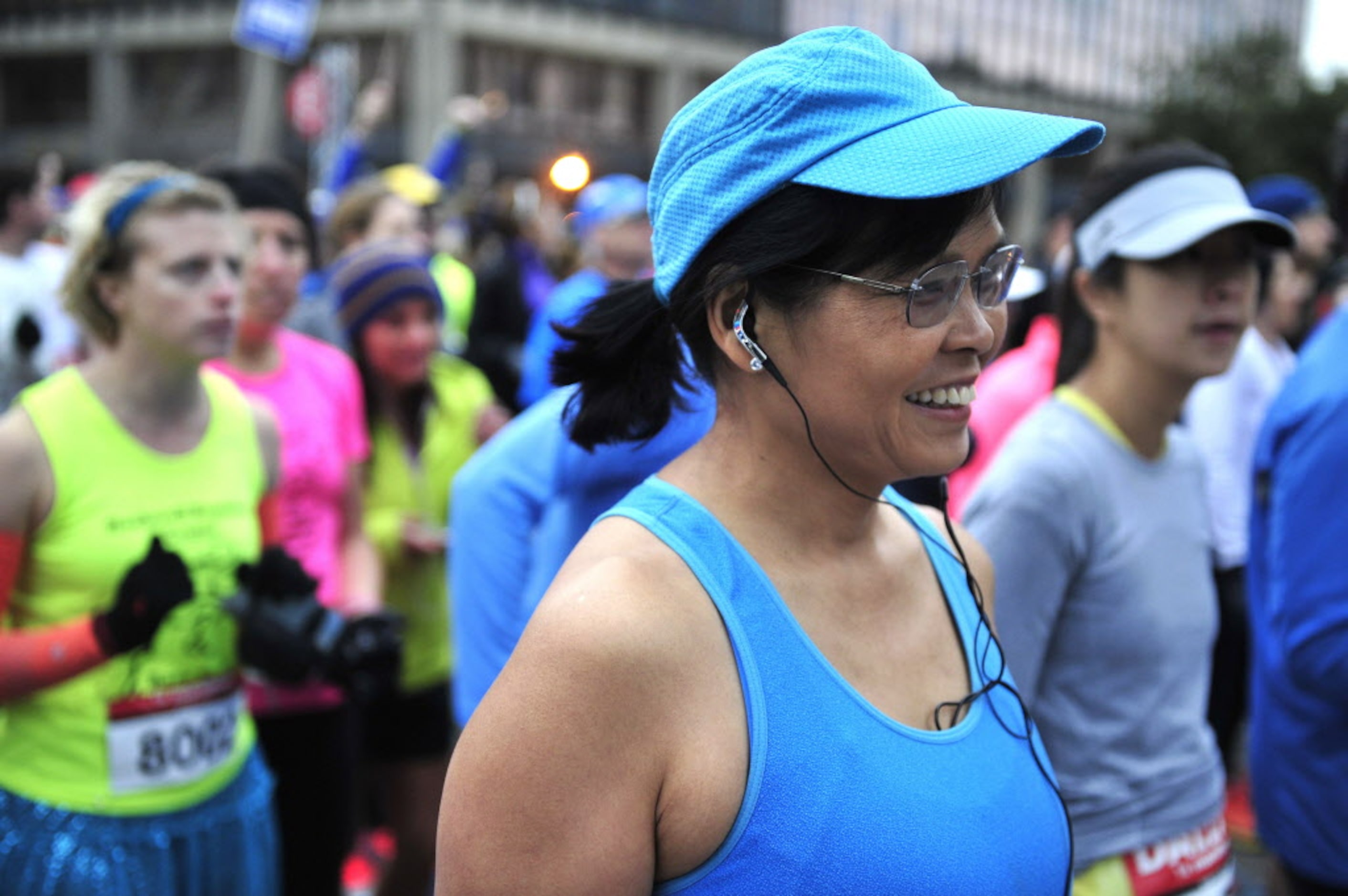 A runner waits for her start at the starting line of the Dallas Rock N' Roll half-marathon...