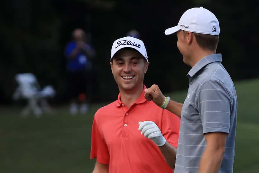 HONOLULU, HI - JANUARY 12:  Justin Thomas of the United States is congratulated by Jordan...