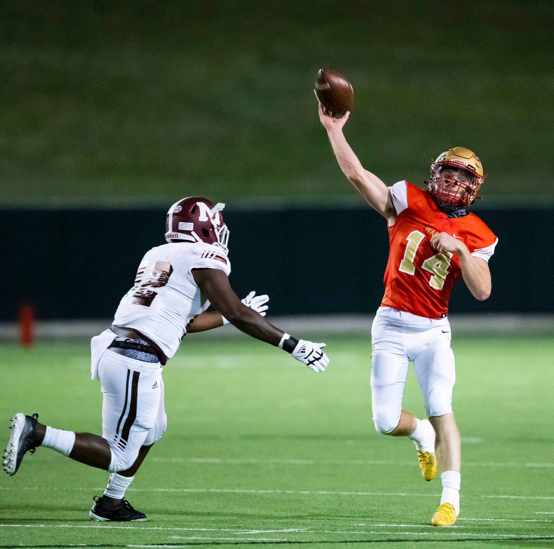 South Grand Prairie senior quarterback Sean Stegall (14) throws as Mesquite junior defensive...