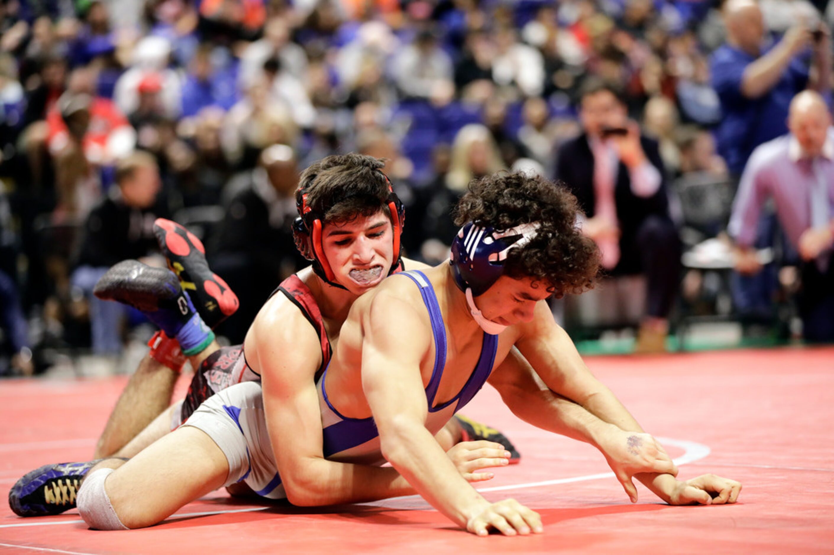 Dominic Chavez of Arlington Martin wrestles during the UIL Texas State Wrestling...