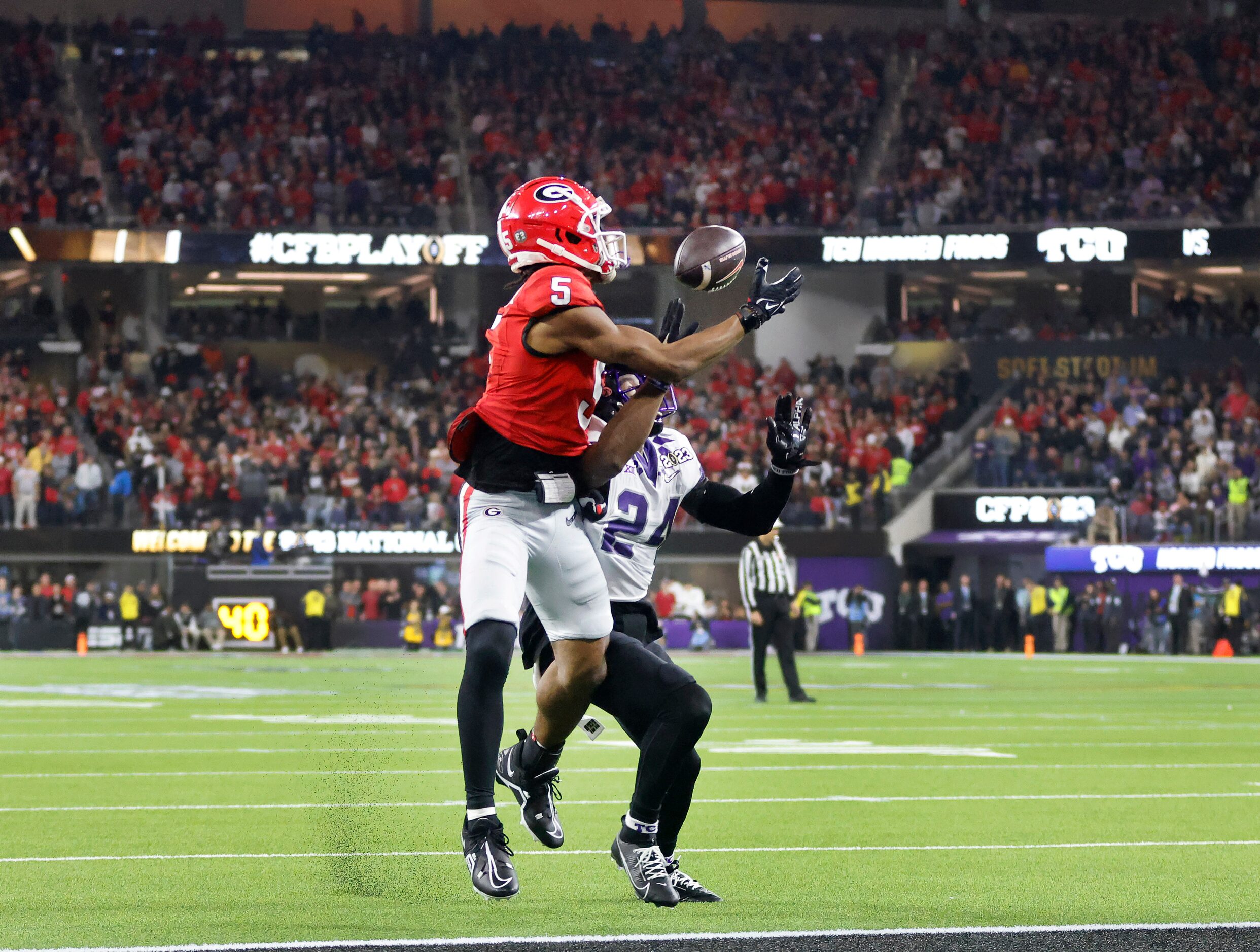 Georgia Bulldogs wide receiver Adonai Mitchell (5) pulls in a touchdown pass against TCU...