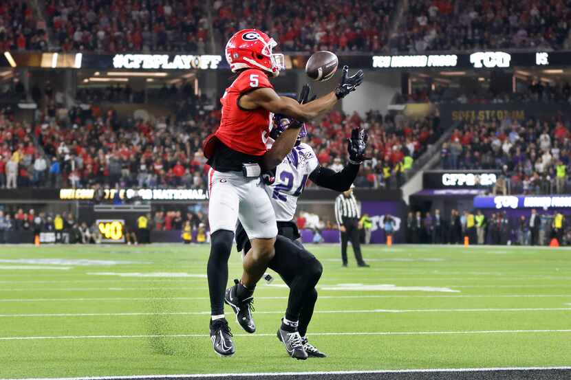 Georgia Bulldogs wide receiver Adonai Mitchell (5) pulls in a touchdown pass against TCU...