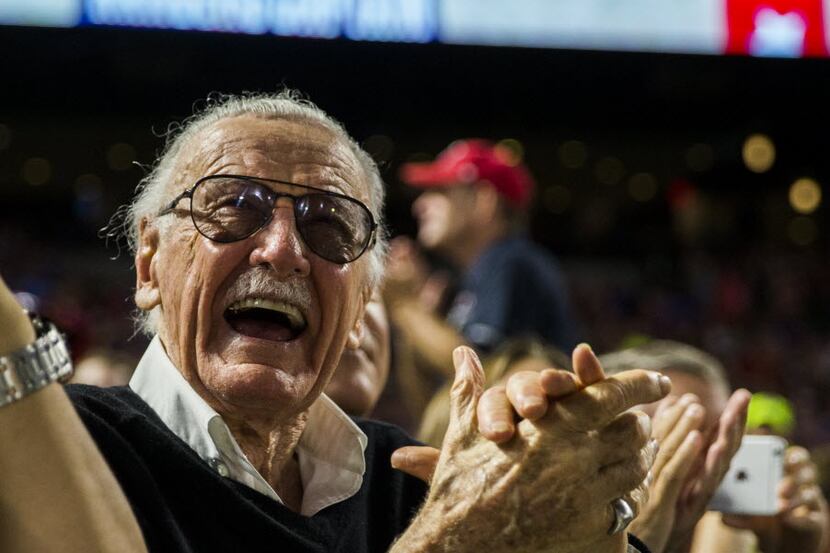 Former president and CEO of Marvel Comics Stan Lee cheers as the Spider Man theme song is...