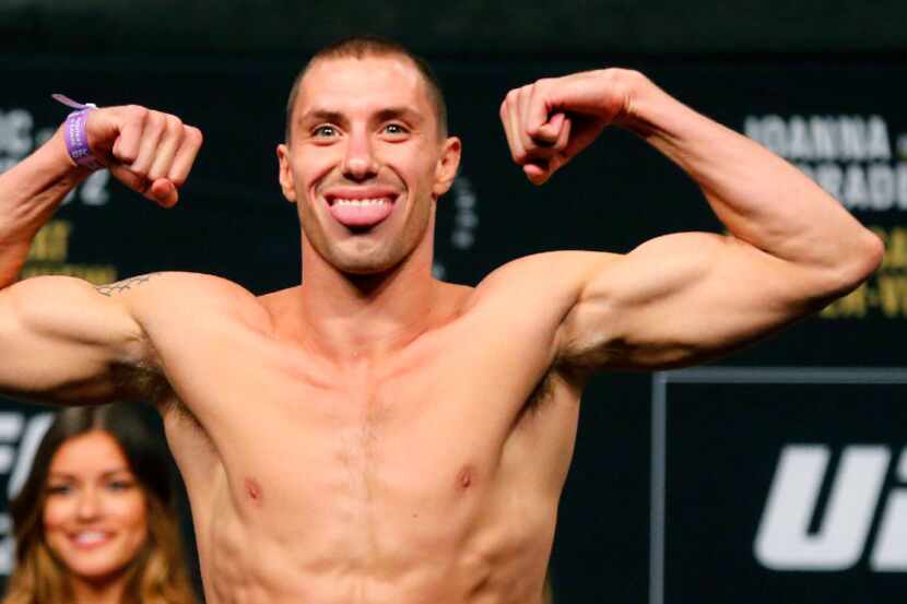 Lightweight fighter James Vick strikes a pose during UFC 211 weigh-in at the American...