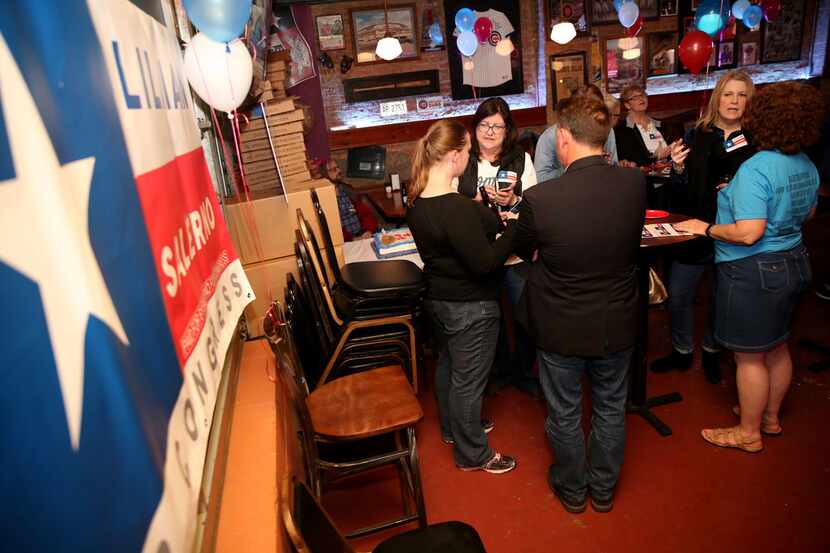 People gather in support of Lillian Salerno, a Democratic candidate headed to a runoff in...