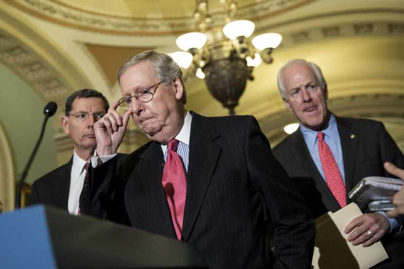  From left: Sen. John Barrasso (R-Wyo.), Senate Majority Leader Mitch McConnell (R-Ky.) and...