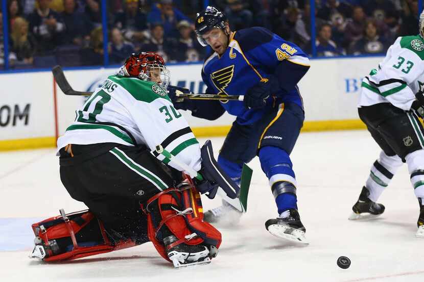 Tim Thomas #30 of the Dallas Stars makes a save against the St. Louis Blues at the Scottrade...