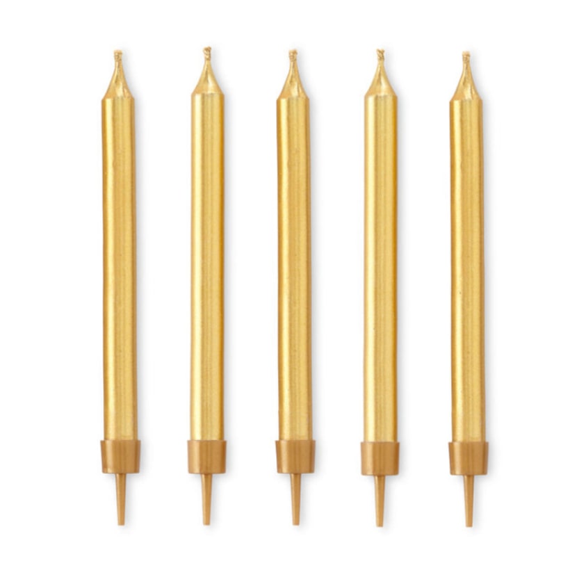 Shimmery gold candles are among the many party preparations at J.C. Penney's Martha Stewart...