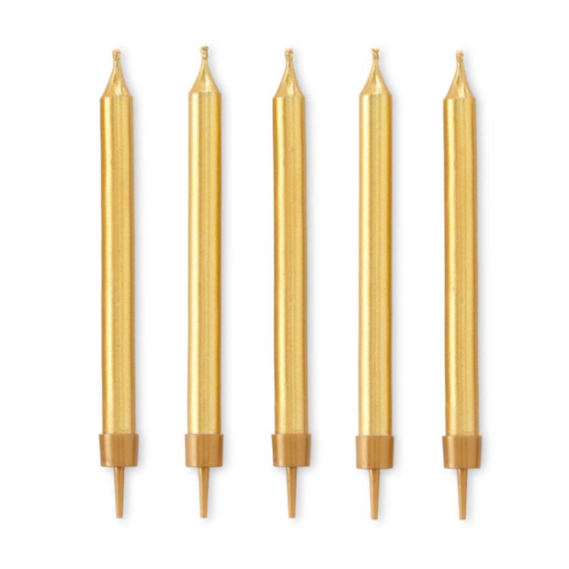Shimmery gold candles are among the many party preparations at J.C. Penney's Martha Stewart...