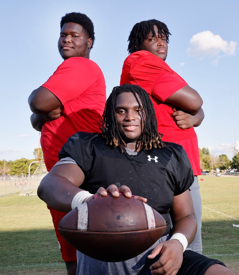 Cedar Hill High School football players, triplets Jordan (from left) Isaiah and Devin...