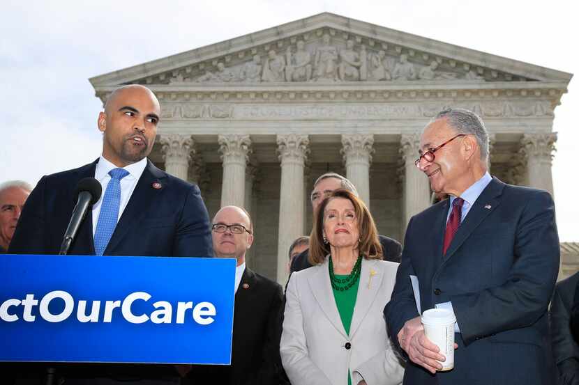 Rep. Colin Allred, D-Texas, from left, with House Speaker Nancy Pelosi of California and...
