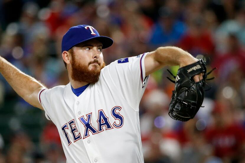 Texas Rangers relief pitcher Sam Dyson throws a pitch against Kansas City Royals during the...