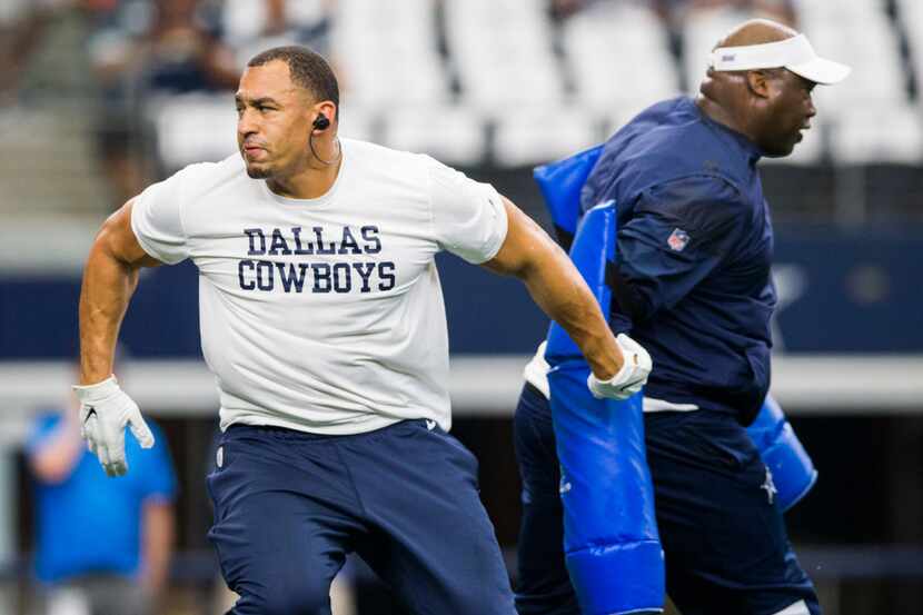Dallas Cowboys defensive tackle Tyrone Crawford (98) warms up before an NFL game between the...