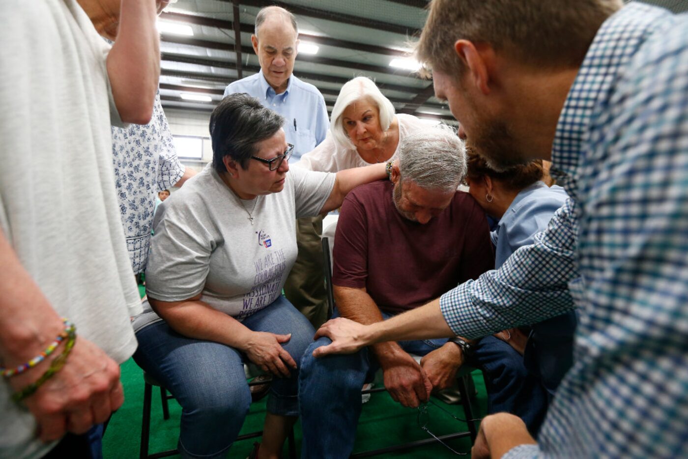 Cathy Norris and her husband, Danny, pray about his upcoming double knee replacement Sunday...