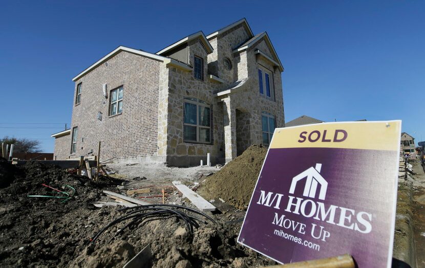 In this Tuesday, Feb. 2, 2016, file photo, a sold sign sits next to a house under the final...