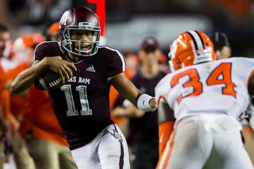 FILE - Texas A&M quarterback Kellen Mond (11) runs the ball during the third quarter of a...