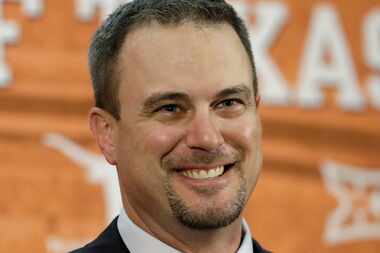 Tom Herman talks to the media during a news conference where he was introduced as Texas' new...