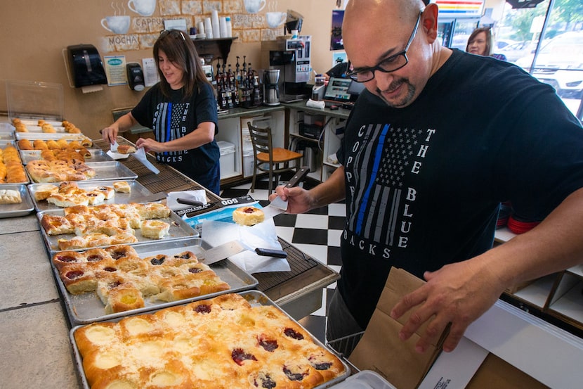 Kasa Kolache bakery owners Enrique Barrera (right) and Gloria Barrera prepare a kolache...