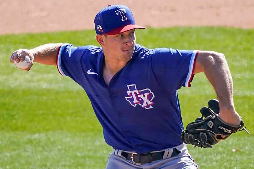 Rangers pitcher Brett de Geus delivers during the sixth inning of a spring training game...