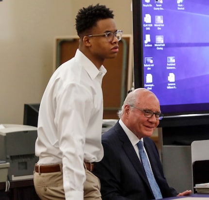 Taymor McIntyre sits down with his defense attorney,  Jeff Kearney, during his trial on...