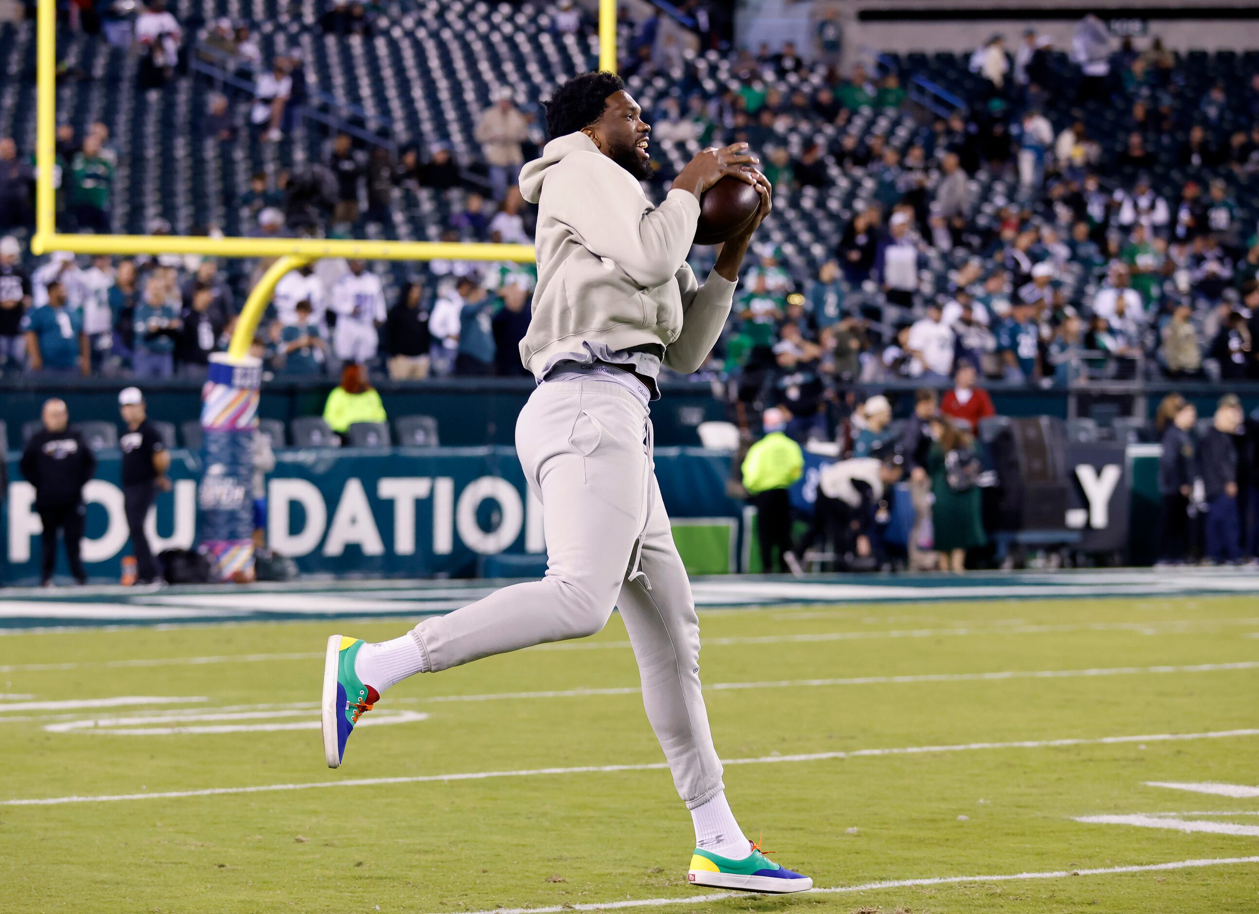 Philadelphia 76ers basketball player Joel Embiid catches a pass before the Philadelphia...